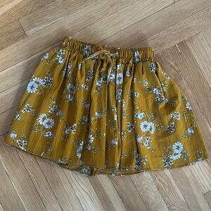 Floral Mustard shorts that mimic a skirt